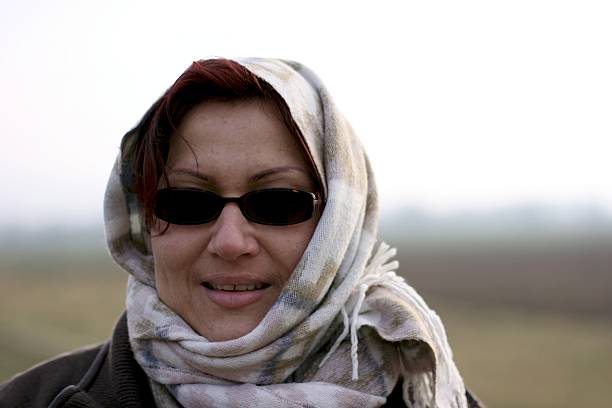 Portrait of beautiful  tourist woman in Oman, with scarf around her head.
