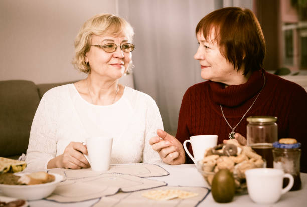 istock Smiling elderly females drinking tea 912587858