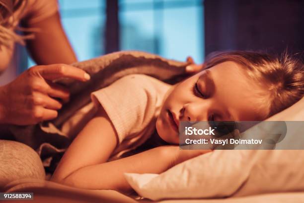 Mom And Daughter At Home Stock Photo - Download Image Now - Child, Sleeping, Bedtime