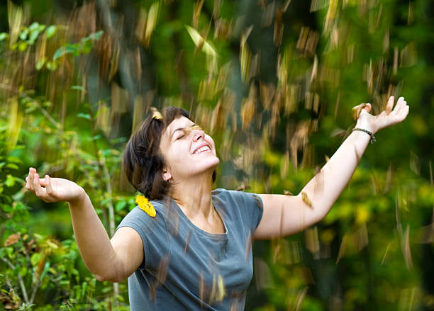 istock Young woman with falling leaves 91258995