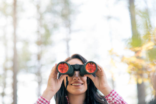 istock Close-up of beautiful woman with binocular 912592702