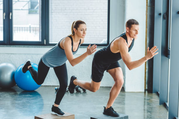 istock man and woman having cross training in gym 912593330
