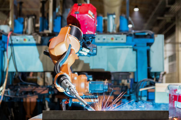 istock Orange industrial robot is welding assemblycar part in factory 912596238