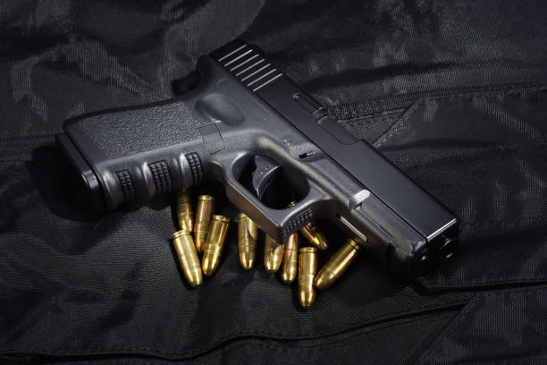 istock Police weapon and equipment on black uniform background 912596870