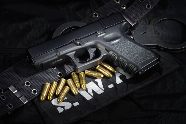 istock SWAT weapon and equipment on black uniform background 912596930