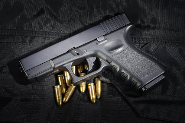 istock Police weapon and equipment on black uniform background 912596998