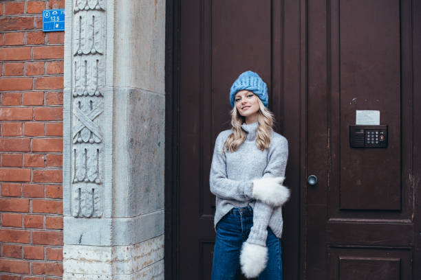 istock Woman in blue hat and white mittens 912597104