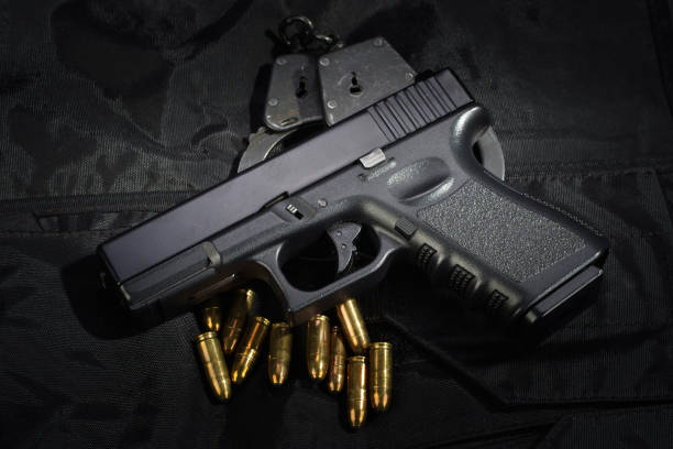 istock Police weapon and equipment on black uniform background 912599164