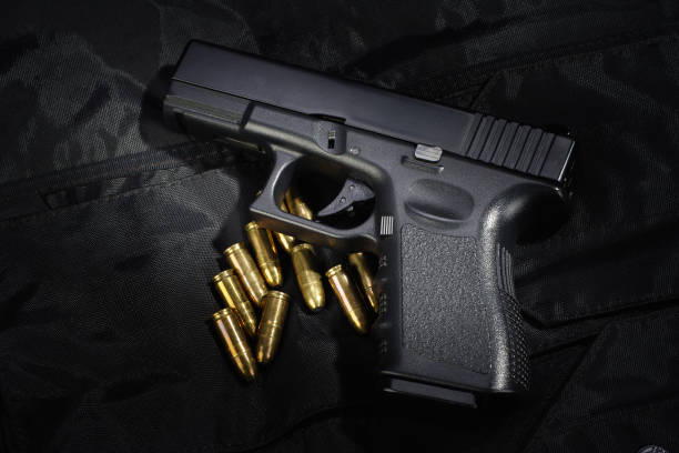istock Police weapon and equipment on black uniform background 912599382