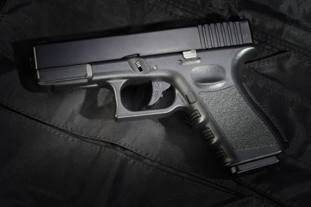 istock Police weapon and equipment on black uniform background 912599518