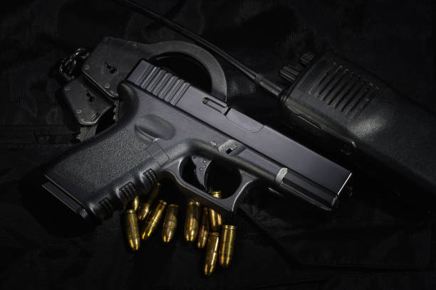 istock Police weapon and equipment on black uniform background 912599594