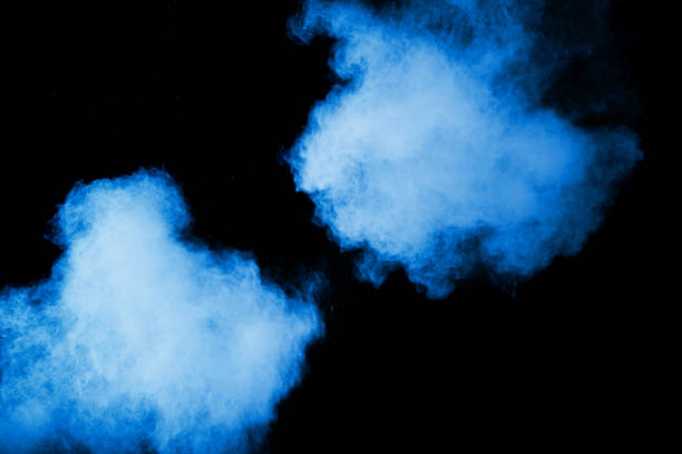 istock Abstract blue dust explosion on  black background. Blue powder splattered on black background. Freeze motion of blue powder splash. 912599632