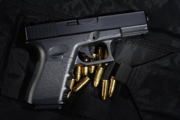 istock Police weapon and equipment on black uniform background 912599658