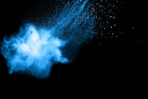 istock Abstract blue dust explosion on  black background. Blue powder splattered on black background. Freeze motion of blue powder splash. 912599660