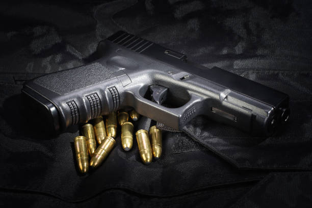 istock Police weapon and equipment on black uniform background 912599728