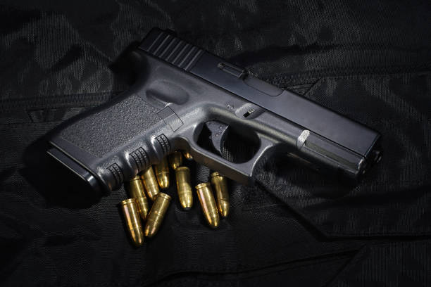istock Police weapon and equipment on black uniform background 912600080