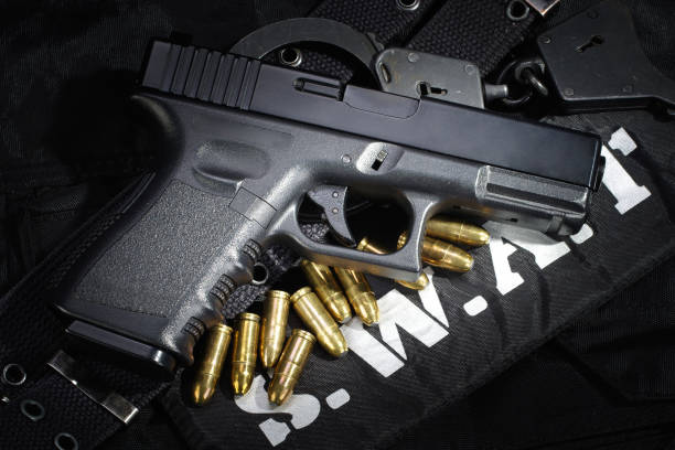 istock SWAT weapon and equipment on black uniform background 912600140