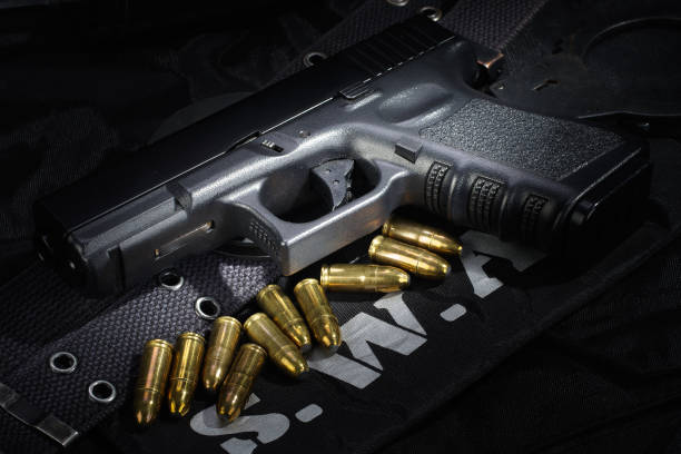 istock SWAT weapon and equipment on black uniform background 912600288
