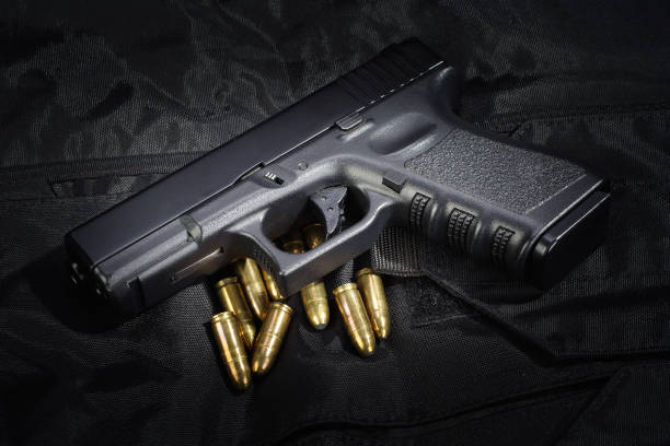 istock Police weapon and equipment on black uniform background 912600506