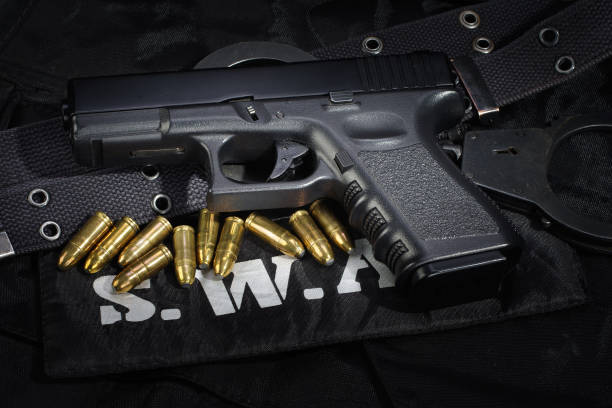 istock SWAT weapon and equipment on black uniform background 912600616