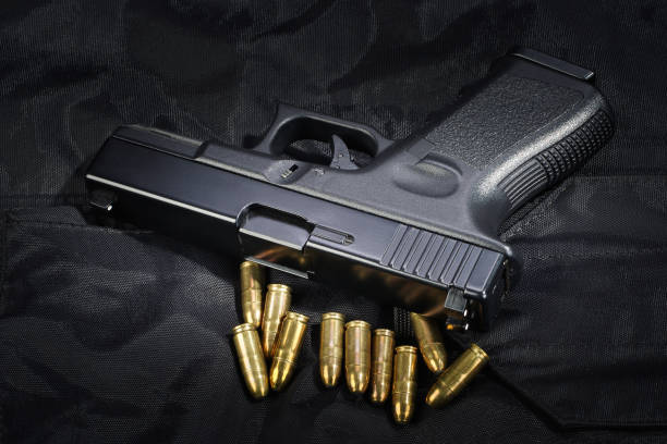 istock Police weapon and equipment on black uniform background 912600696