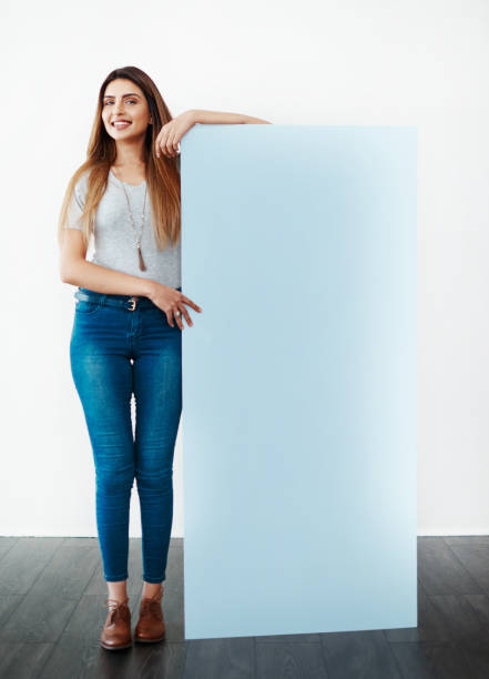 it's something she stands by - placard women holding standing imagens e fotografias de stock