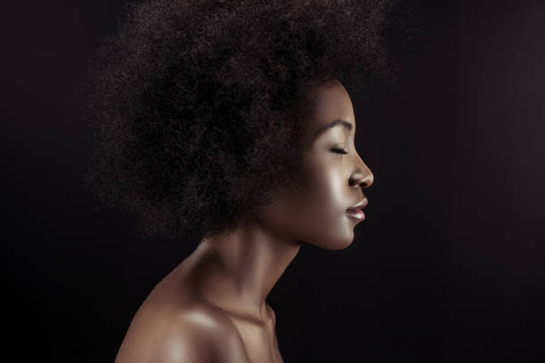 profile of attractive african american woman isolated on black stock photo