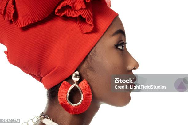 Side View Of Young African American Woman In Wire Head Wrap Isolated On White Stock Photo - Download Image Now