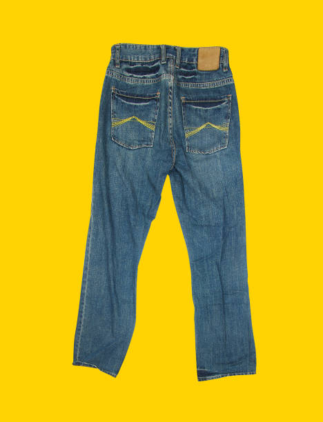 istock Casual jeans on yellow background 912604296