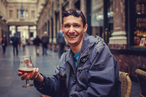 istock A man drinking beer in a public place. 912604430
