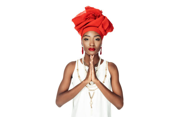 young african american woman making prayer gesture isolated on white