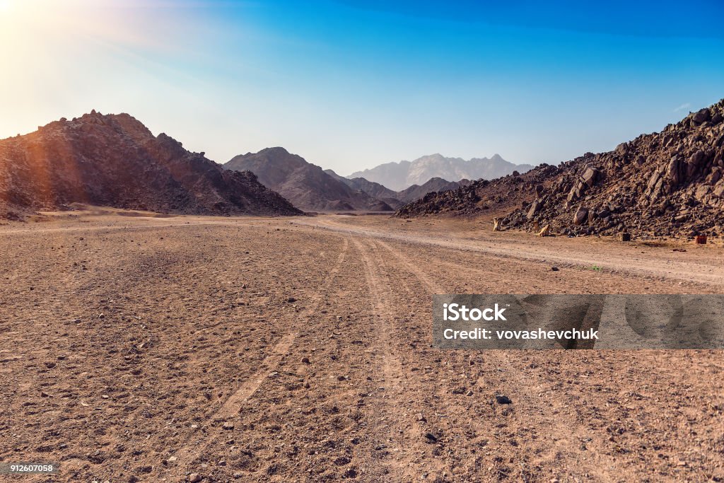 Arabian desert in Egypt tracks from the car in Arabian desert in Egypt Dirt Road Stock Photo