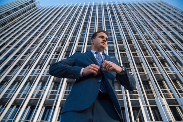 istock Confident businessman on urban background 912607356