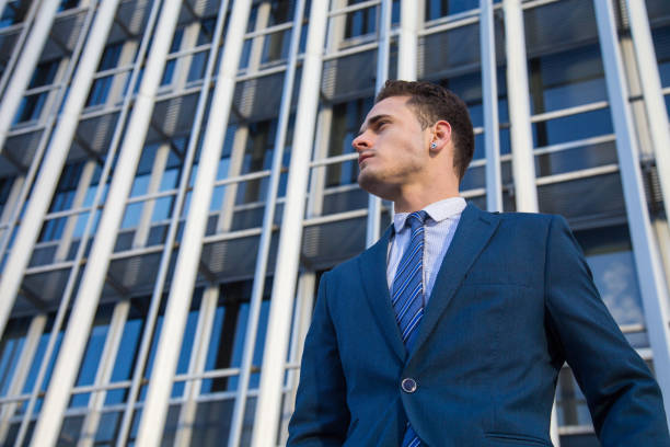 istock Confident businessman on urban background 912607434