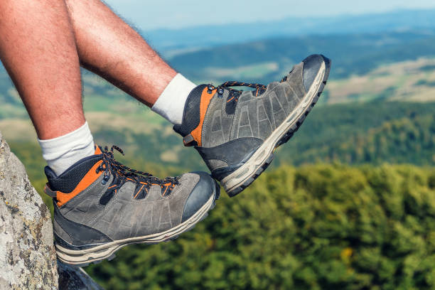 istock hiking boots on male legs 912607506