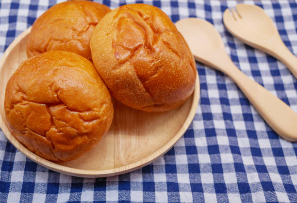 istock Breads in wooden plate with spoon and fork 912608074