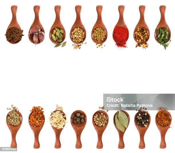 Different Seasonings And Spices In Wooden Spoons Stock Photo - Download Image Now - Spice, Spoon, Herb