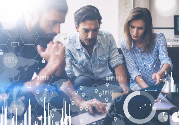 istock Coworking process in a sunny office.Young Business team making discussing at office.Concept of digital diagram,graph interfaces,virtual screen,connections icon.Horizontal,blurred background. 912611350