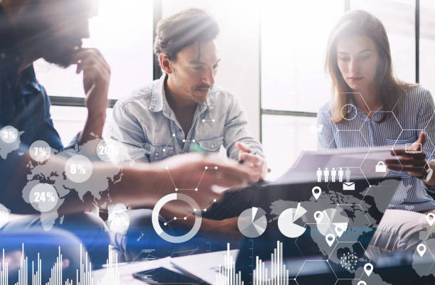 istock Concept of digital diagram,graph interfaces,virtual screen,connections icon on blurred background.Presentation new business project.Group of young coworkers discussing ideas in modern office. 912612784