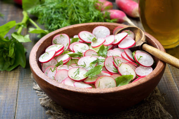 istock Fresh vegetable salad with radish, cucumber and herbs 912613454