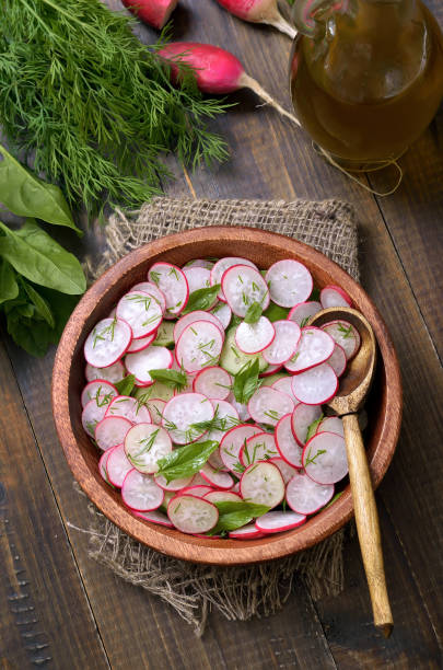istock Fresh vegetable salad with radish, cucumber and herbs 912613900