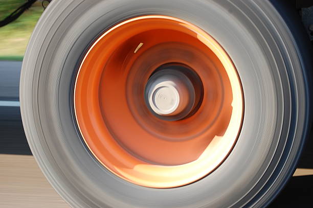 istock Spinning and Moving Truck Tire - Orange 91261420