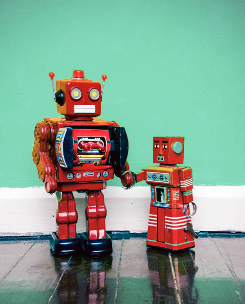 ロボット グッズ家族父と息子 - robot conformity toy retro revival ストックフォトと画像