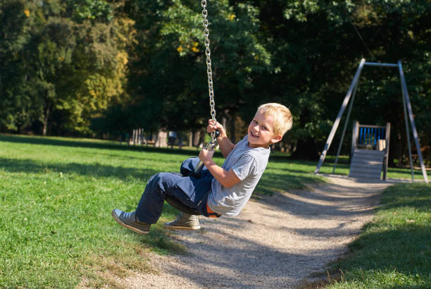 istock Child boy rides on Flying Fox play equipment 912617374