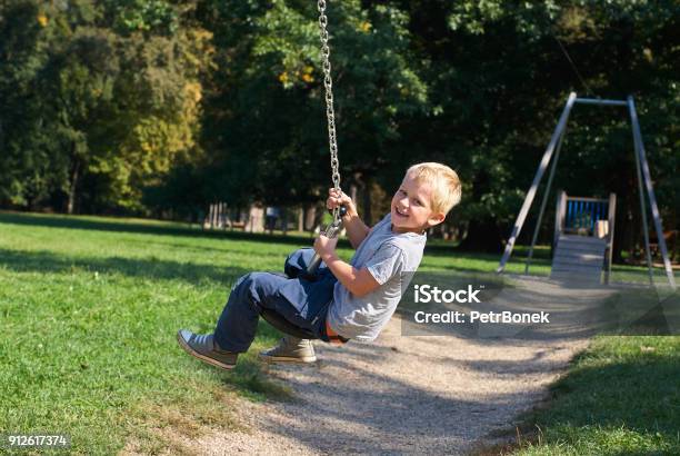 Child Boy Rides On Flying Fox Play Equipment Stock Photo - Download Image Now - Active Lifestyle, Activity, Adventure