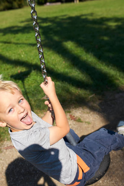 istock Child boy rides on Flying Fox play equipment 912617784