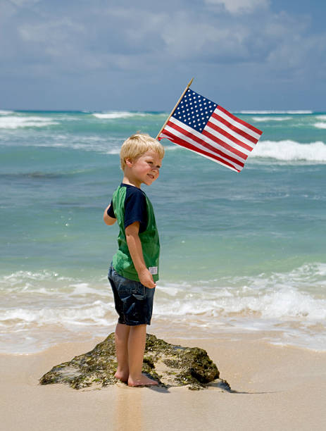 istock Boy with the American Flag on a Beach 91261816