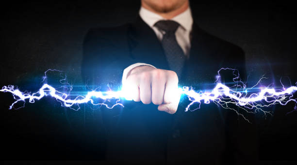 istock Business man holding electricity light bolt in his hands 912618816