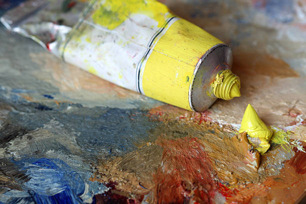 istock Yellow oil paint on a palette 91262529