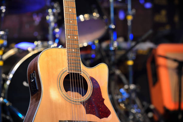 istock Guitar and other musical equipment on stage before concert 912628296
